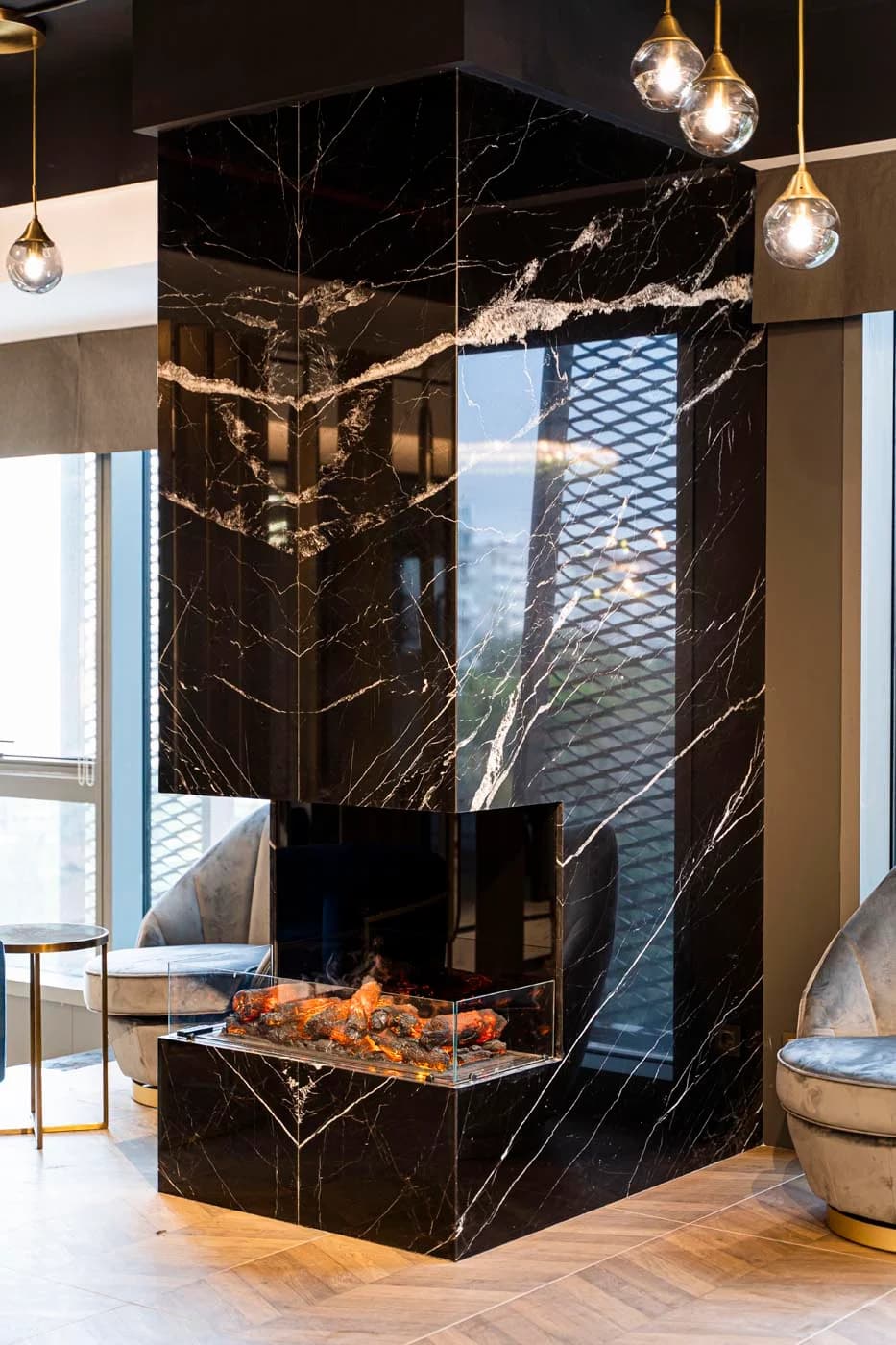 Black marble fireplace in the Auradentis waiting area