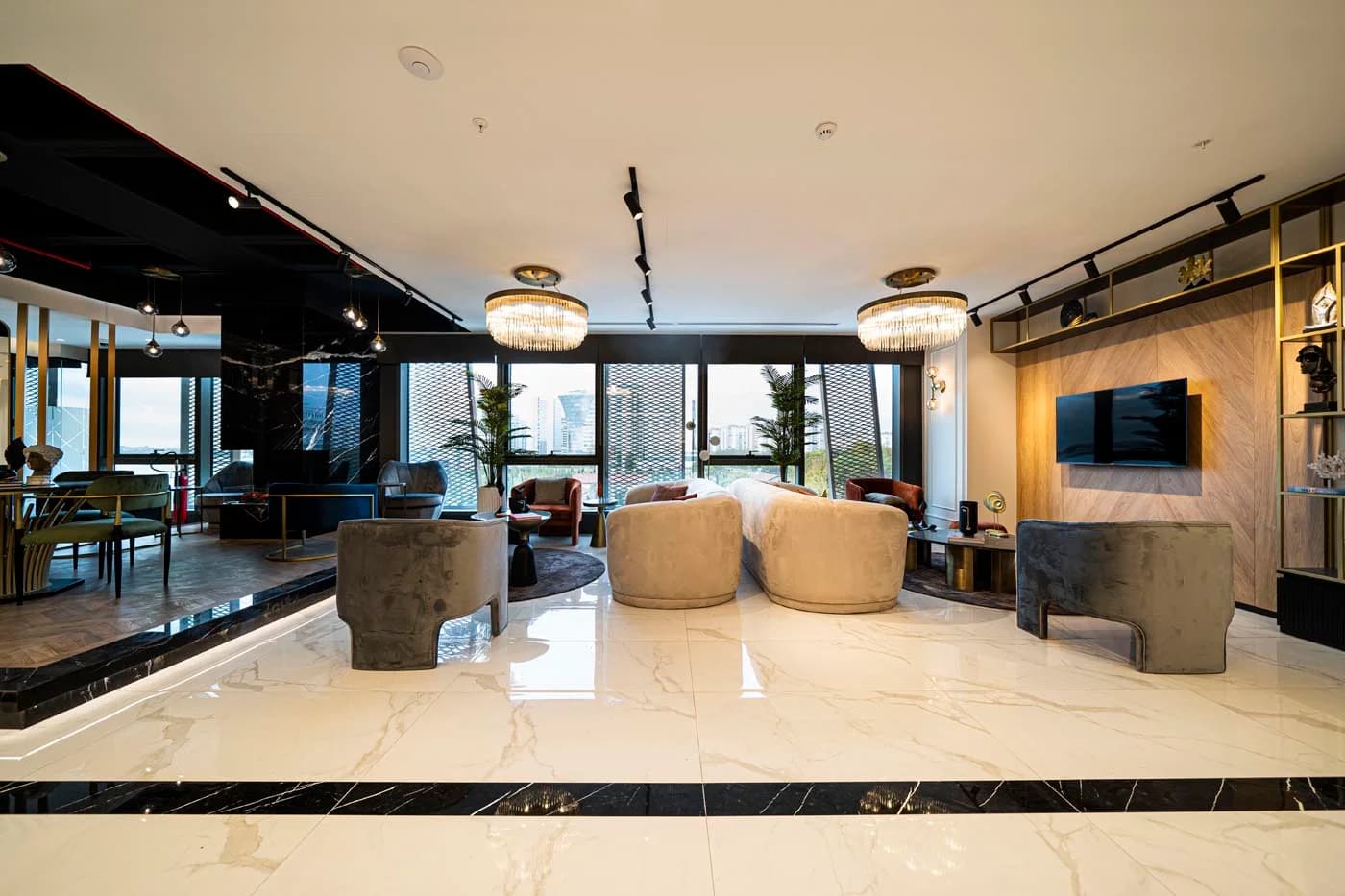 Patient lounge at Auradentis with marble floors and floor-to-ceiling windows